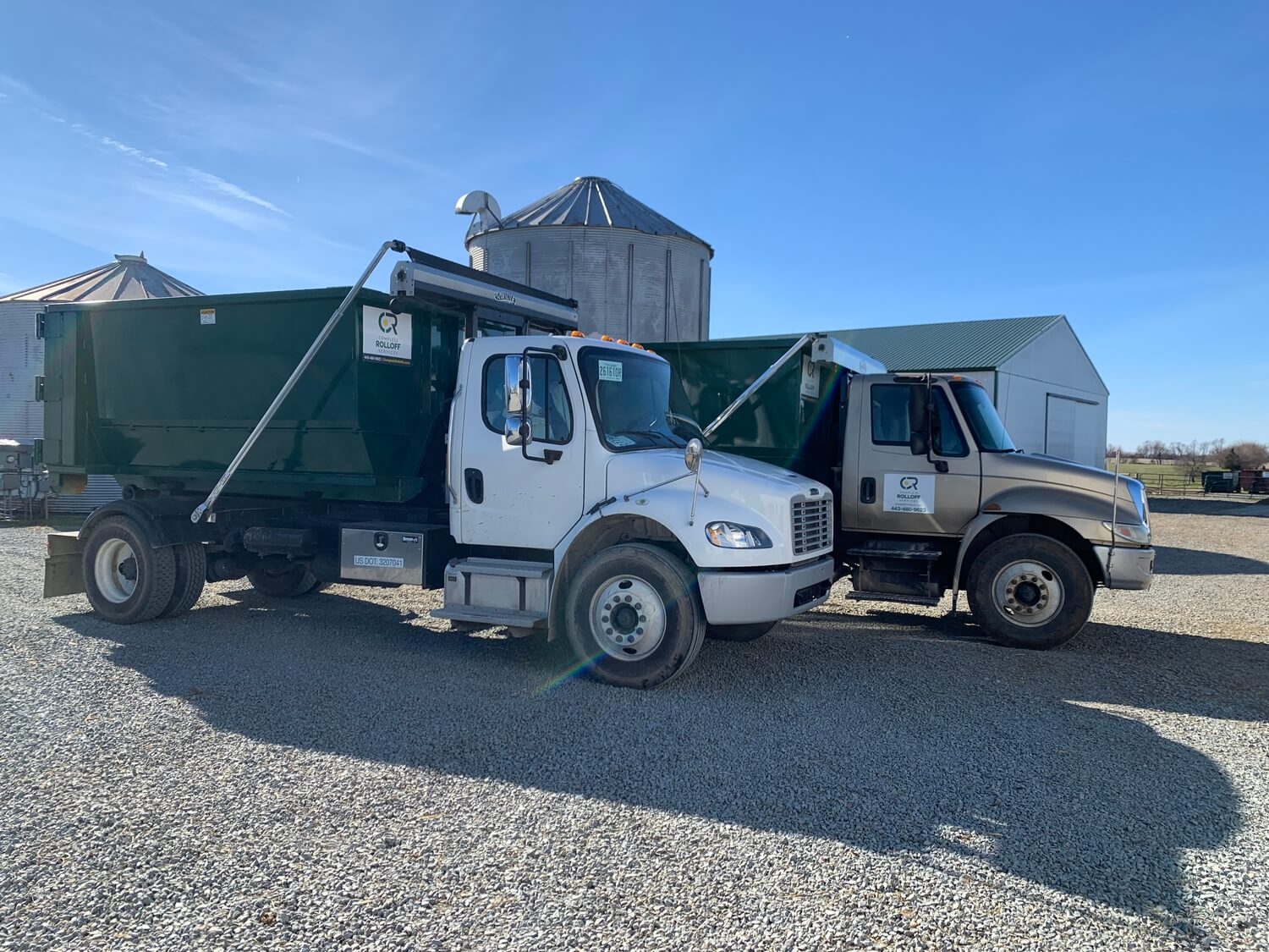 1550700236 Complete Rolloffs Dumpster Trucks in the Yard