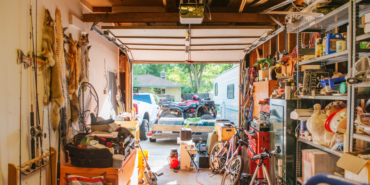 Interior of a messy garage with not enough space to park a vehicle