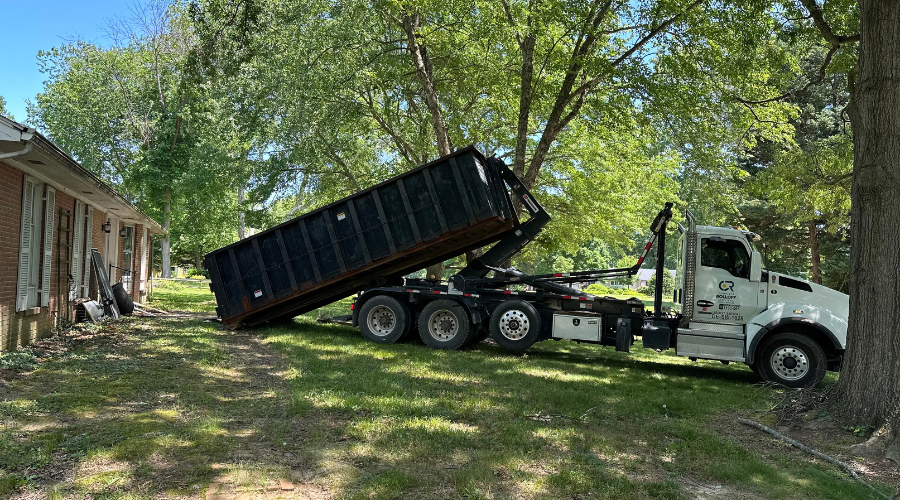 Complete Rolloff Services dropping off a dumpster rental for a home project
